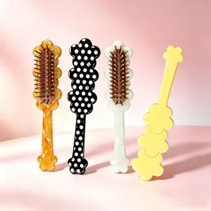 Detailed view of cute floral pattern acetate hair cushion massage brushes in four colors.