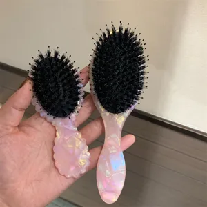 Set spazzola per capelli in acetato rosa con setole di cinghiale, pettine da massaggio dettagli.