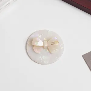 Pearl acetate bow compact mirror detail, elegant daily makeup pocket mirror for women.