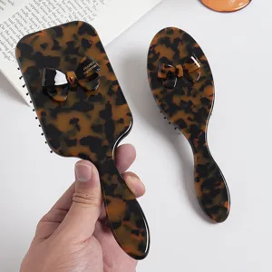 Tortoiseshell hair brush set with elegant bow design, portable daily styling air cushion brush.