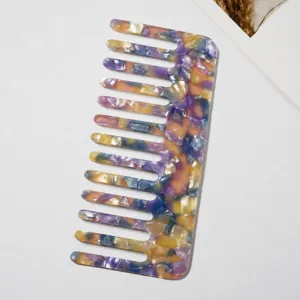 Acetate wide-tooth hair comb detail view, marble pattern anti-static design for styling.