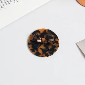 Portable tortoiseshell pattern compact mirror with cute bow design, perfect for daily use.