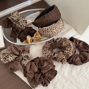Brown leopard print hair scrunchies and headband set, retro Maillard style fabric bow hair accessories.