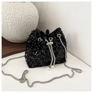 Stylish black sequin bucket bag for women, elegant chain strap and pearl evening handbag.