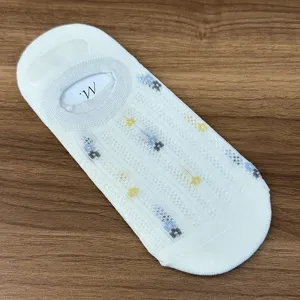 Close-up detail of white mesh floral boat socks, breathable cotton invisible socks for women.
