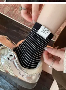 Cute striped cotton mid-calf socks with puppy patch, perfect for casual spring and autumn wear.