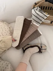 Retro ruffle mid-tube socks for women, stylish cozy knit hosiery daily wear.