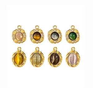 Closeup of vintage gold metal cat eye stone pendant jewelry DIY accessories details display