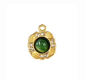 Green cat eye stone gold pendant detail with delicate leaf motifs and sparkling crystal accents.