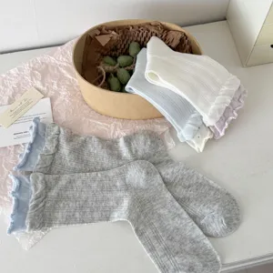 Detailed view of women cotton mesh ruffle mid-tube socks, breathable loose top design.