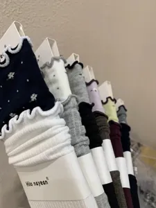 Korean style ruffled mid-calf stacking socks detail, floral cotton knit sock collection.