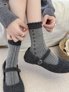 Detailed view of grey sweet floral crew socks for women, retro ruffled cuff cotton socks.