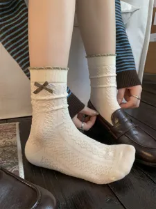 Vintage Koreaanse stijl dameskousen met schattige strik en fijne gebreide textuur voor herfst.