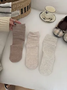 Detailed view of vintage hollow diamond socks, Korean style lettuce edge mid-tube knit hosiery.