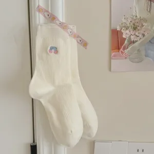 Sweet balletcore style white ribbed mid-tube socks with cute embroidered bow motif for women.