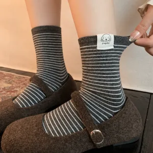 Cute striped mid-calf socks for women, retro grey and white cotton knitwear with puppy label.