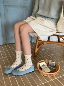 Floral ruffle mid-calf socks detail shot, retro aesthetic cotton sock daily wear style.