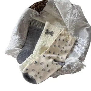 Vintage Japanese style cotton mid-tube crew socks with cute bow and floral patterns.