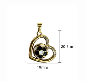 Detail shot of gold heart pendant with black white football and rhinestones accessories