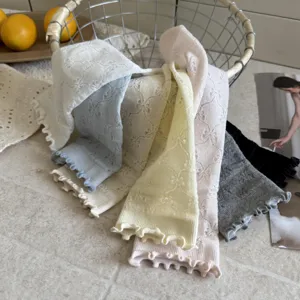 Details of sweet ruffle lace mesh mid-tube socks in multiple colors, delicate knit texture.