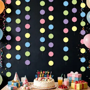 Colorful dot paper garland and birthday party background setup detail view for kids celebration.