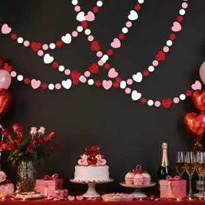 Valentine's Day heart garland decoration scene showing red pink white paper hanging strings for party.