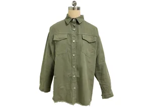Olive green denim shirt detail, featuring metal snap buttons, dual chest pockets, raw hem.