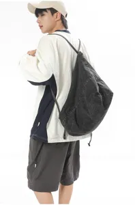 Casual denim drawstring backpack for men and women, versatile student daily shoulder bag.