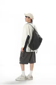 Casual denim drawstring backpack for daily use, versatile streetwear bag with durable fabric.