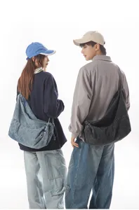 Detailed close-up view of casual denim shoulder bag, versatile crossbody design.