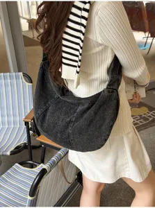 Casual denim hobo shoulder bag with stylish pleats and large daily capacity design.