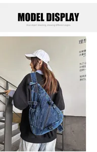 Vintage washed denim crossbody chest bag featuring multiple pockets and adjustable shoulder strap.