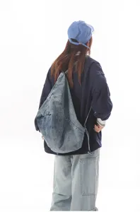 Casual denim backpack for women, versatile multi-functional student school bag daily use.