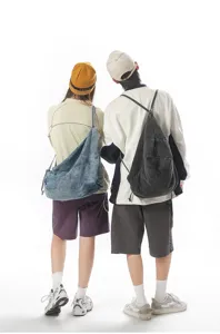 Casual canvas backpack and denim shoulder bag, detailed view of casual back style.