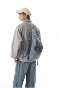 Casual denim drawstring backpack for daily use, simple fashion shoulder bag for students.