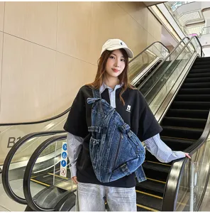 Vintage washed denim chest bag detail showing multi-pocket design and adjustable straps for daily wear.