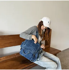 Vintage washed denim backpack for women, large capacity shoulder and crossbody bag.