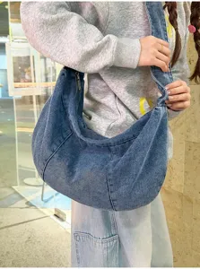 Detail view of the casual denim shoulder hobo bag, featuring soft fabric and ample daily capacity.