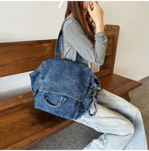 Retro washed denim large capacity shoulder messenger bag for women casual daily use.