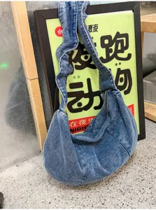 Stylish denim hobo shoulder bag for women, casual pleated crossbody bag with zipper.
