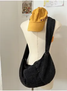 Black denim slouchy hobo shoulder bag detail, casual large capacity pleated messenger style.