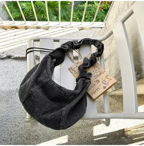 Casual denim shoulder bag for women, large capacity slouchy crossbody purse with pleated strap.