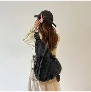 Vintage washed denim sling bag for women, large capacity retro crossbody chest pack.