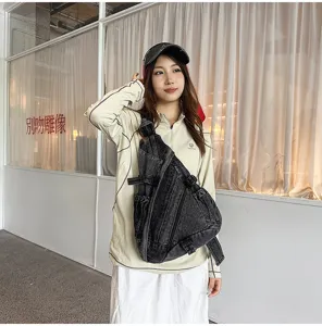Retro washed denim sling bag detail, casual crossbody style with multiple pockets and durable straps.