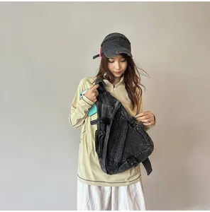Vintage washed denim chest bag for women, retro crossbody sling bag with large capacity.