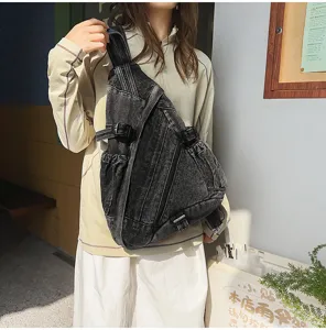 Retro washed denim sling bag for women, vintage crossbody chest bag with large capacity.