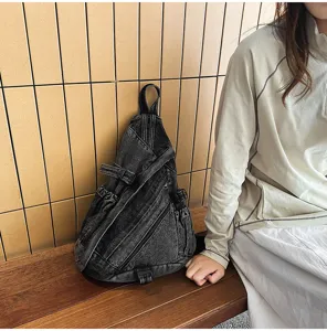 Detailed view of retro washed dark grey denim sling chest bag, featuring unique triangular design.