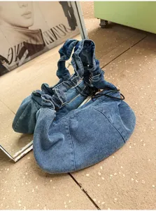 Trendy denim shoulder bag for women, casual slouchy hobo purse with stylish ruched strap.