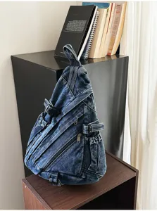 Vintage washed denim sling backpack for women, casual crossbody chest bag with multi pockets.