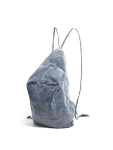 Minimalist casual denim backpack for daily use, versatile solid color student bookbag.